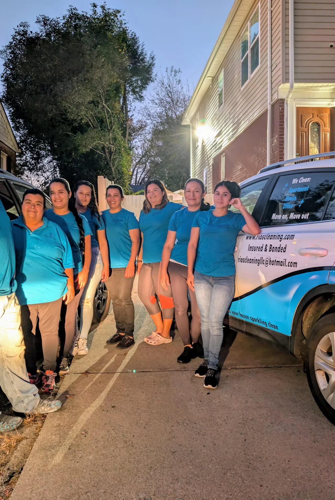 The Rios Cleaning Services team together beside a company vehicle